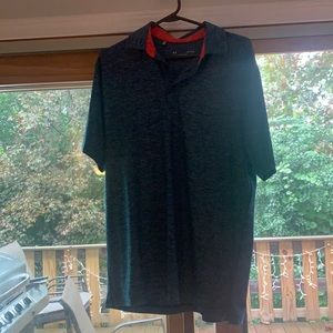 Medium underarmour navy collared shirt with orange accent color inside collar